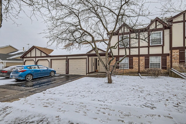 tudor home featuring a garage