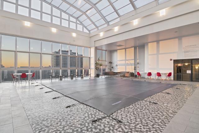 gym featuring a high ceiling