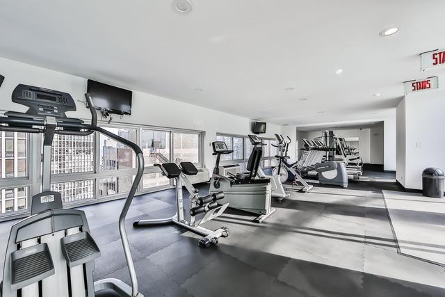 exercise room featuring recessed lighting