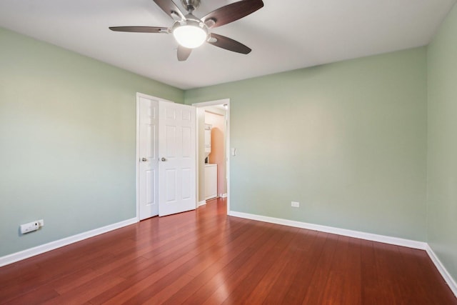 spare room with hardwood / wood-style flooring and ceiling fan