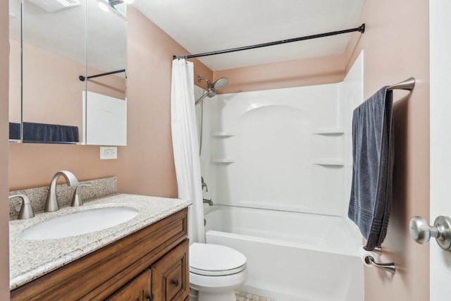 full bathroom featuring vanity, shower / bath combo, and toilet