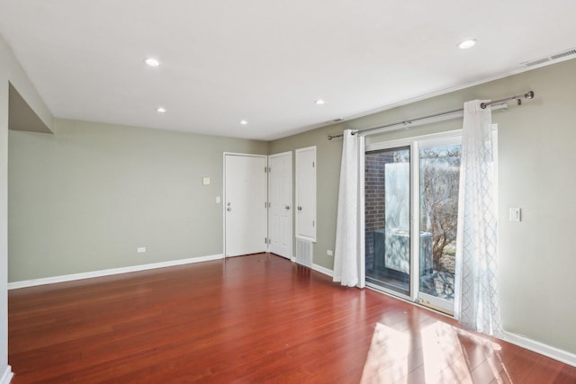 empty room with dark hardwood / wood-style floors