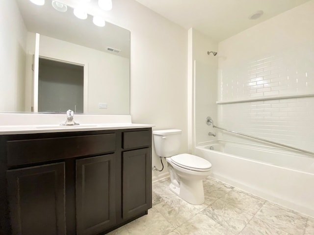 full bathroom with vanity, tiled shower / bath combo, and toilet