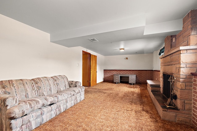 living room featuring carpet floors and a fireplace