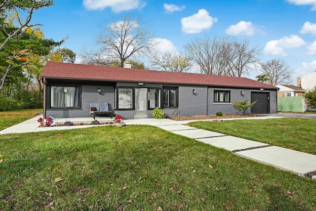 ranch-style house with a front yard and a garage