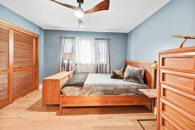 bedroom featuring a closet, ceiling fan, and light hardwood / wood-style flooring