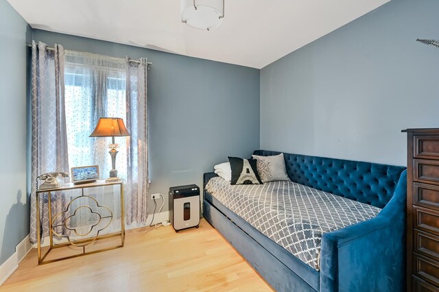 bedroom featuring hardwood / wood-style floors