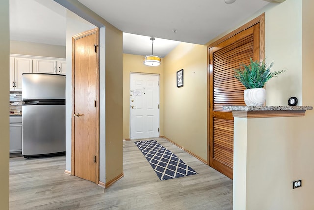 foyer entrance featuring light wood-type flooring