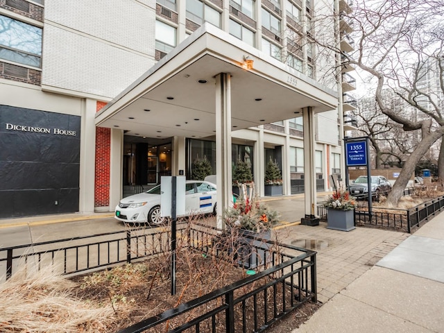 entrance to property featuring brick siding