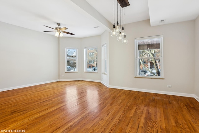 unfurnished room featuring hardwood / wood-style floors and ceiling fan