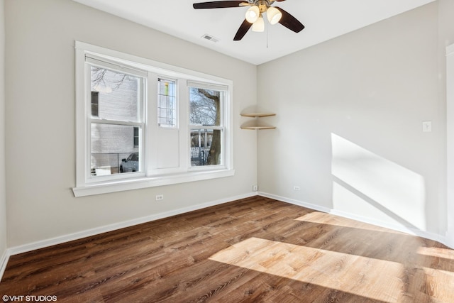 empty room with wood-type flooring and ceiling fan