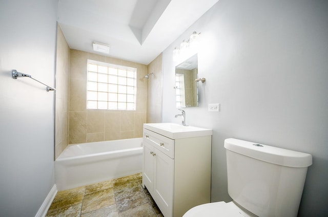 full bathroom with tiled shower / bath combo, vanity, and toilet