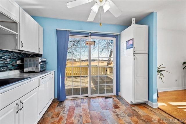 interior space with ceiling fan, sink, and hardwood / wood-style floors