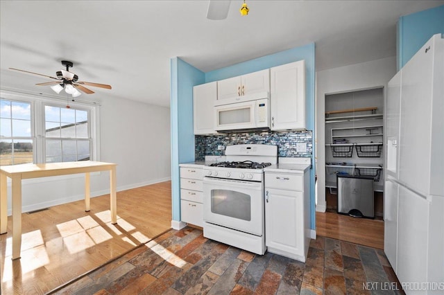 kitchen with white cabinetry, ceiling fan, white appliances, and decorative backsplash