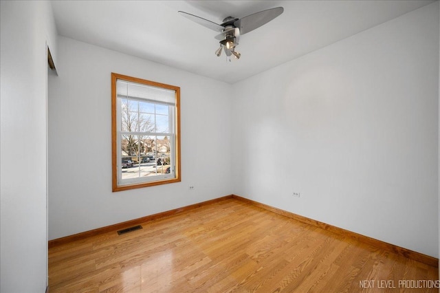 unfurnished room featuring light hardwood / wood-style flooring and ceiling fan