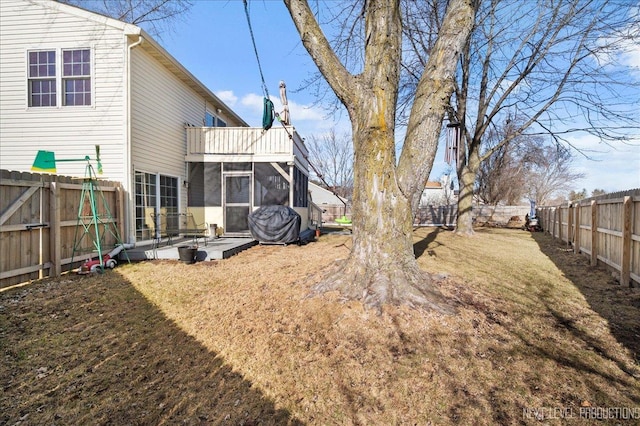 view of yard featuring a patio and a sunroom