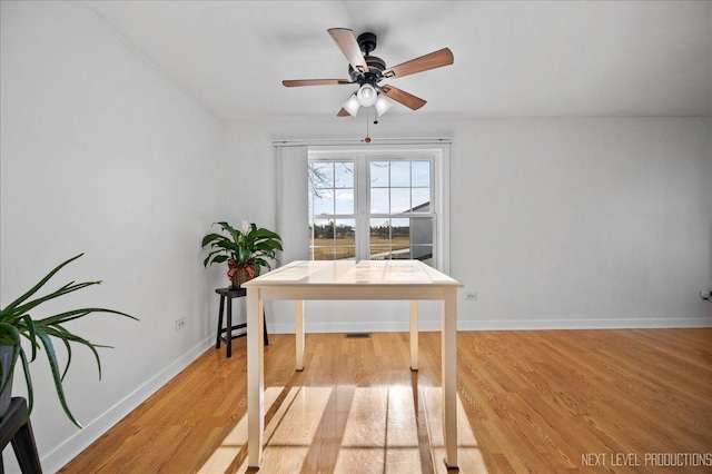 office with ceiling fan and light wood-type flooring