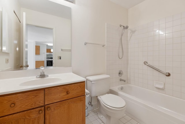 full bathroom with tile patterned flooring, vanity, toilet, and tiled shower / bath