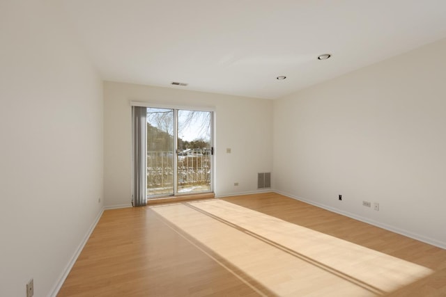 unfurnished room with light hardwood / wood-style flooring