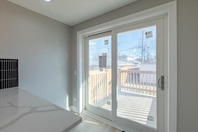 doorway to outside with light hardwood / wood-style floors