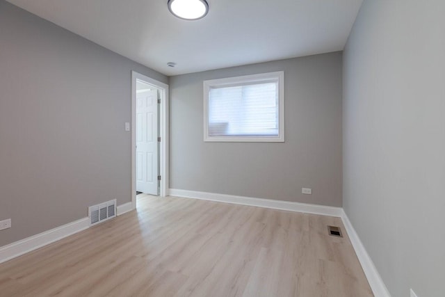 empty room with light hardwood / wood-style floors