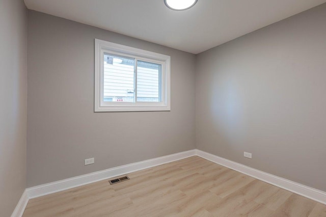 spare room with light hardwood / wood-style flooring