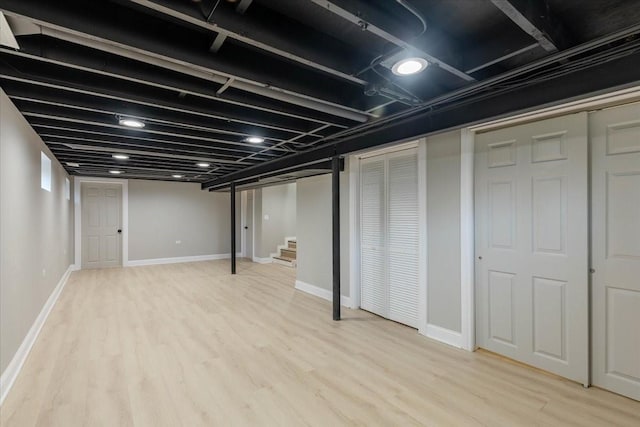 basement featuring light wood-type flooring