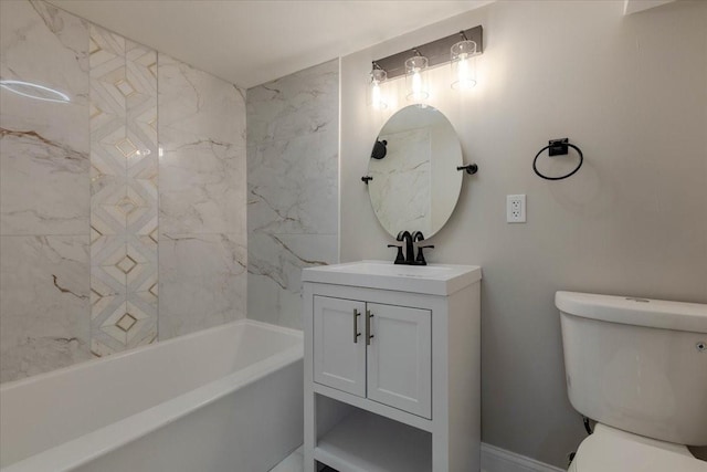 full bathroom with vanity, tiled shower / bath, and toilet