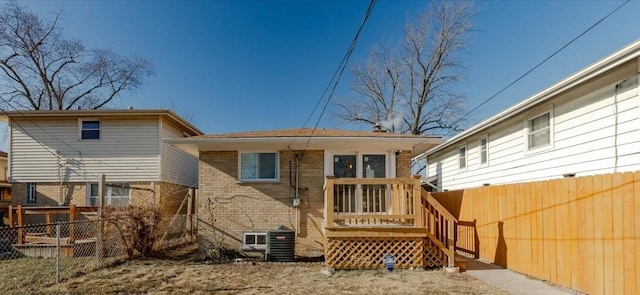 rear view of property featuring central AC