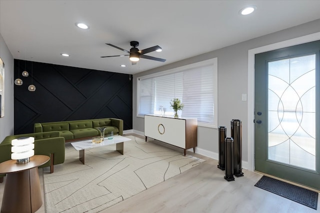 entrance foyer with light hardwood / wood-style flooring and ceiling fan