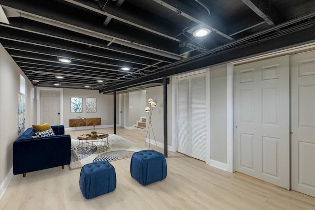 basement with hardwood / wood-style floors