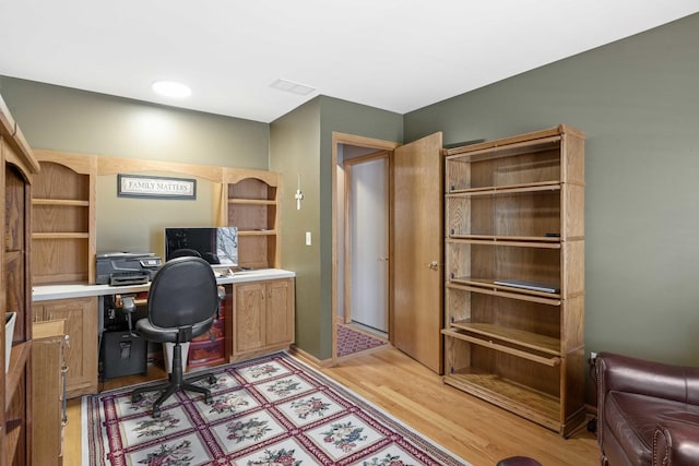 office space with light hardwood / wood-style flooring