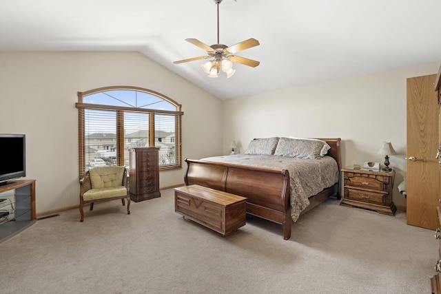 carpeted bedroom featuring vaulted ceiling and ceiling fan