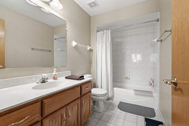 full bathroom with shower / tub combo with curtain, vanity, tile patterned floors, and toilet