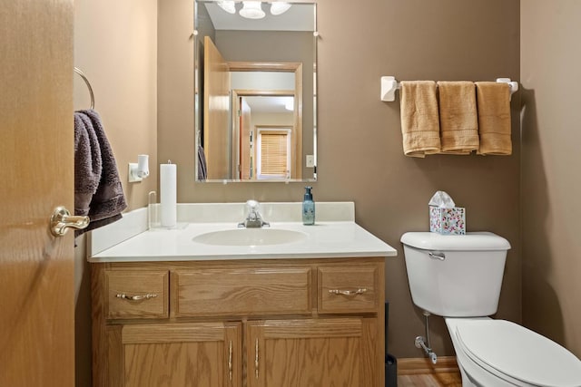 bathroom with vanity and toilet