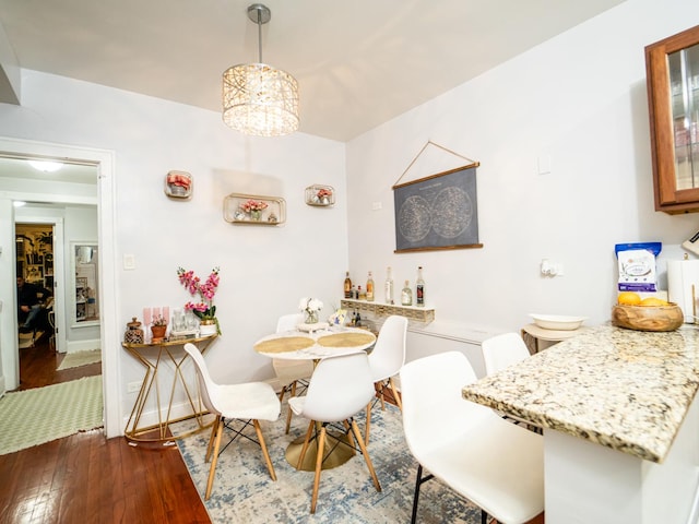 dining room featuring light hardwood / wood-style flooring and a chandelier