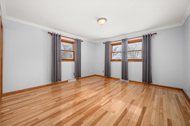 unfurnished room featuring light hardwood / wood-style floors and ornamental molding