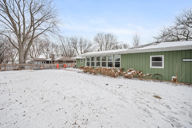 view of snow covered house