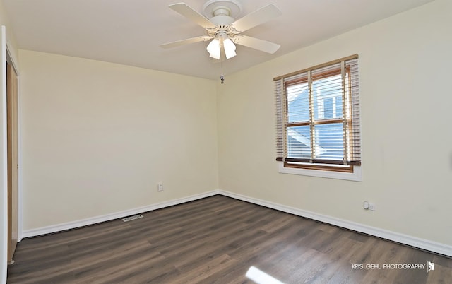 unfurnished room featuring dark hardwood / wood-style flooring and ceiling fan