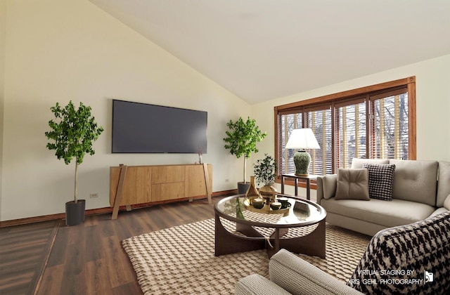 living room featuring dark hardwood / wood-style floors and vaulted ceiling