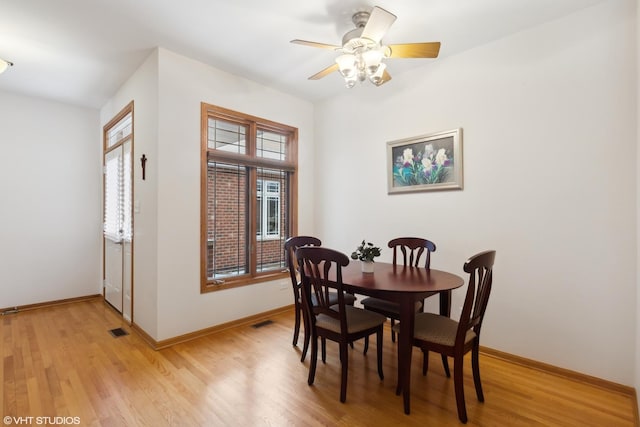 dining space featuring ceiling fan and light wood-type flooring