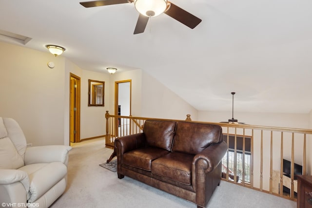 living room featuring lofted ceiling, light carpet, and ceiling fan