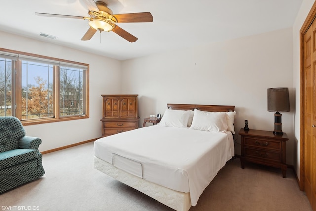 carpeted bedroom featuring ceiling fan