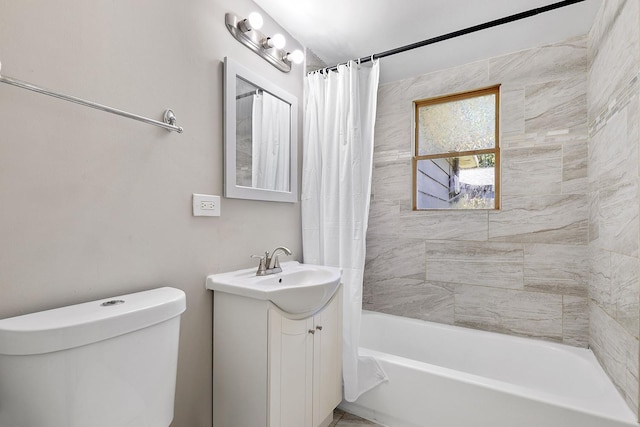 full bathroom featuring vanity, shower / bath combo, and toilet