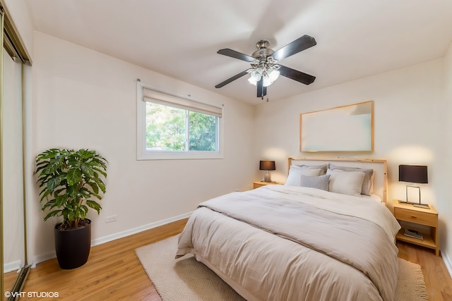 bedroom featuring light wood-type flooring and ceiling fan