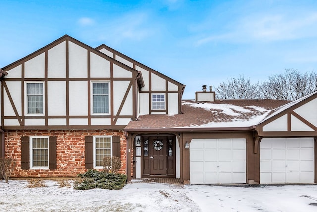 tudor-style house with a garage