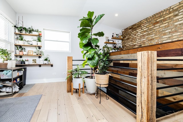 interior space with plenty of natural light and light hardwood / wood-style flooring