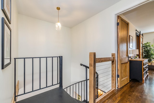 corridor featuring dark hardwood / wood-style flooring