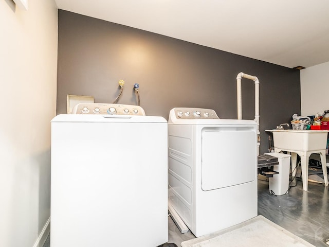 laundry room with sink and washing machine and dryer