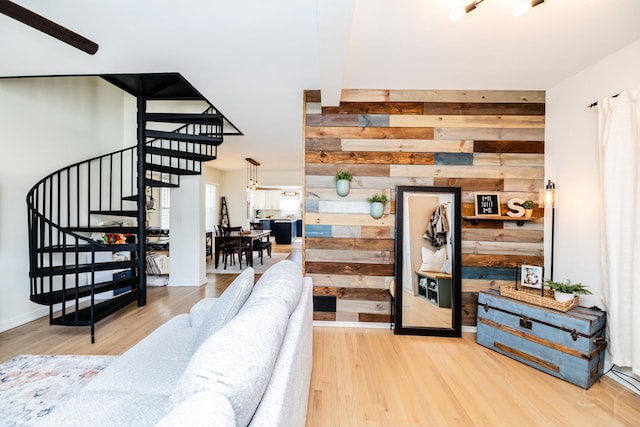 interior space with hardwood / wood-style floors and wooden walls